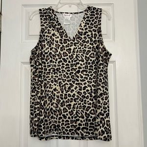 Casual, leopard print shirt; 95% polyester 5% elastine Never worn !